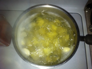 Boiling the potatoes and garlic